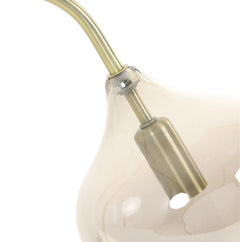 close up on glass head of antique bronze floor lamp