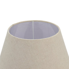 close up on top of washed wood brown urn shaped lamp with linen shade