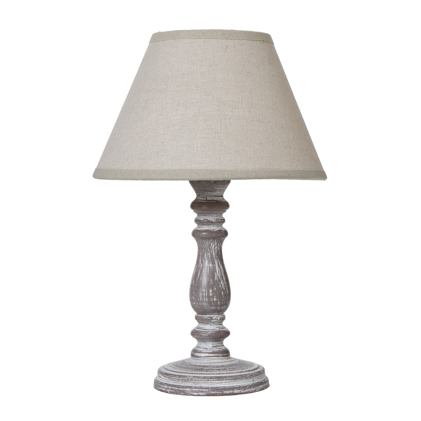 image cut out on white background of weathered-grey lamp base with natural linen edged shade