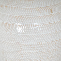 close up on chevron pattern of white ceramic table lamp base
