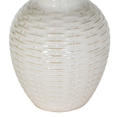 close up on ceramic bottom half of lamp, in white basketweave texture