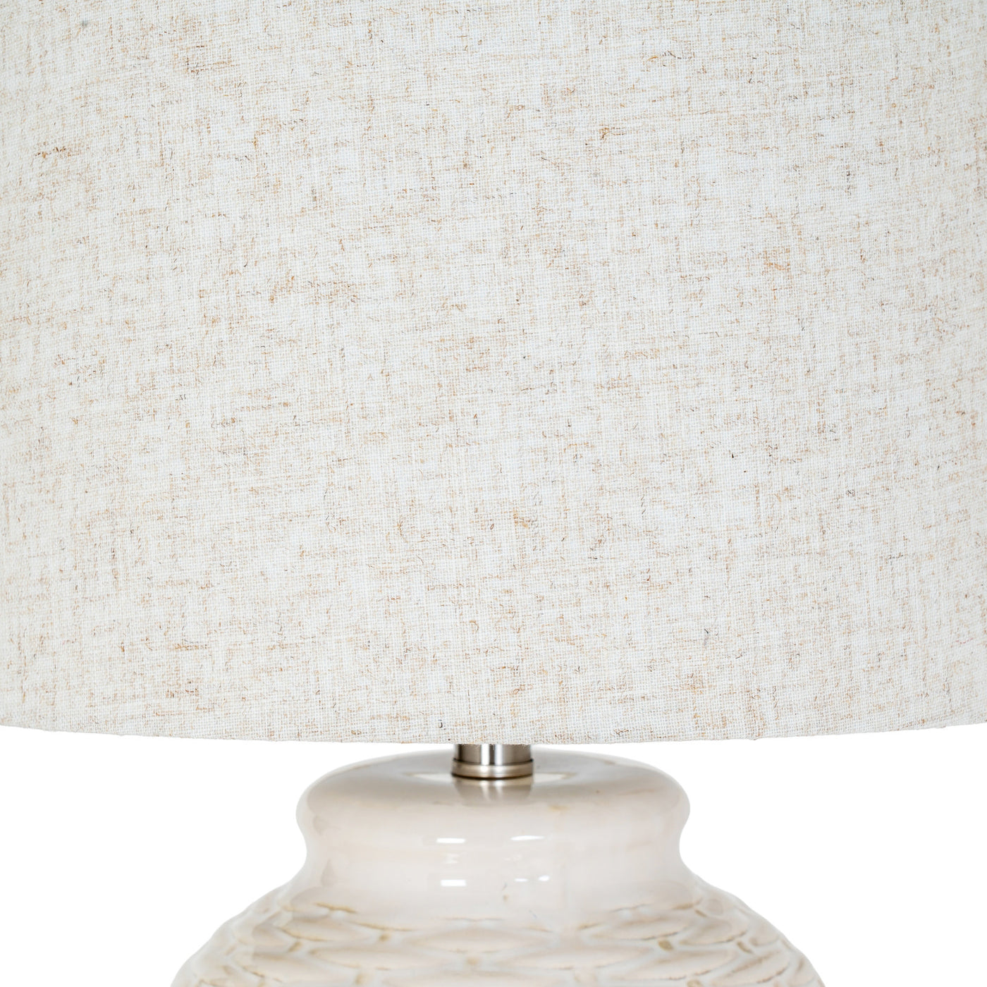 close up on linen shade of ceramic lamp, in an ivory tone
