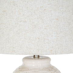 close up on linen shade of ceramic lamp, in an ivory tone