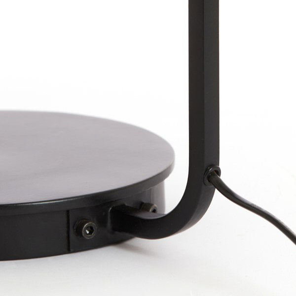 close up on black metal base of table lamp