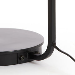 close up on black metal base of table lamp