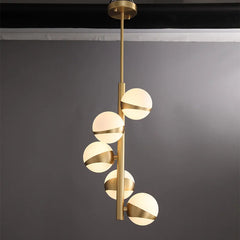 Opal Glass Globe Tiered Chandelier, Bisected Brass Stem, 5 Lights, Staggered Drop, Dining Room & Living Room