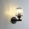 Fluted Glass Cylinder Wall Light, Matt Black Angled Twin-Arm Bracket, Ribbed Clear Glass Shade, Bedside & Hallway