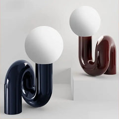 Sculptural Pink Curved Table Lamp with an Opal Glass Sphere Shade, Glossy Lacquer Finish, Console & Living Room