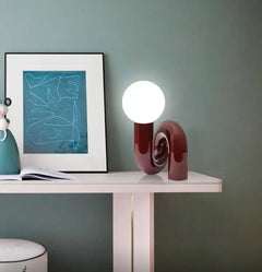 Sculptural Pink Curved Table Lamp with an Opal Glass Sphere Shade, Glossy Lacquer Finish, Console & Living Room