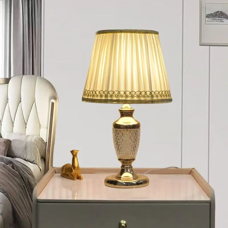 Gold and Brass Table Lamp, Pleated fabric shade in soft cream with a lace-edged hem, Turned Brass Baluster Base, Bedside & Console
