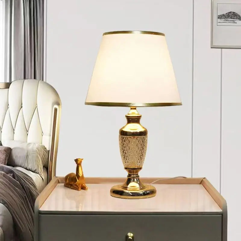 Gold and Brass Table Lamp, Plain pleated ivory fabric shade with a gold rim trim, Turned Brass Baluster Base, Bedside & Console