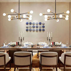 Black and Brass 8 Light Sputnik Chandelier, Asymmetric Rods with Exposed Globe Bulbs, Central Brass Hub, Dining Room & Living Room