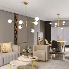 Black and Brass 8 Light Sputnik Chandelier, Asymmetric Rods with Exposed Globe Bulbs, Central Brass Hub, Dining Room & Living Room