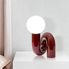 Sculptural Pink Curved Table Lamp with an Opal Glass Sphere Shade, Glossy Lacquer Finish, Console & Living Room