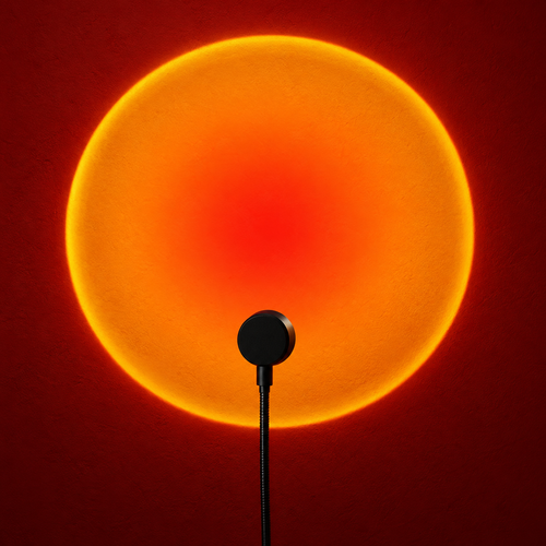 Sepehr black sunset projector casting a warm amber circular light effect onto a red studio wall