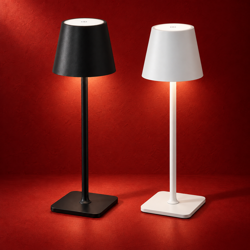 SINA table lamp in black and white, with tapered shades and square bases, shown illuminated against a red studio background.