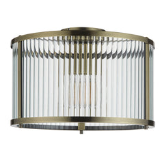 cut out image of clear ribbed glass pendant light with antique brass edges