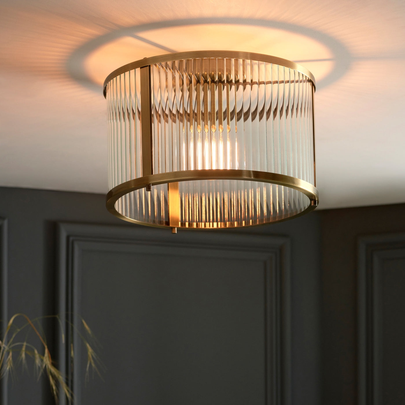 wider shot of ribbed glass ceiling light with antique brass