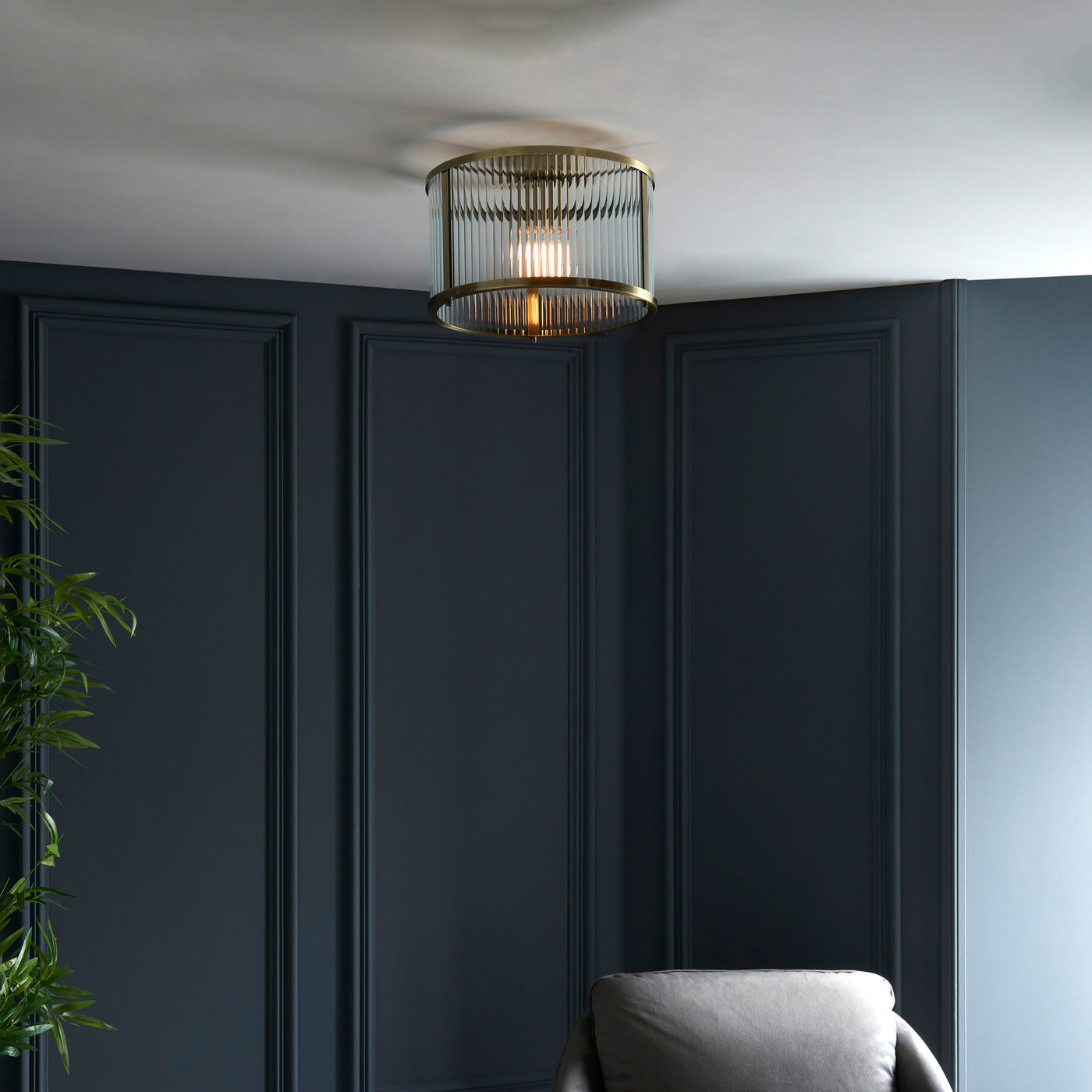 super zoomed out shot of ribbed glass ceiling light in living room