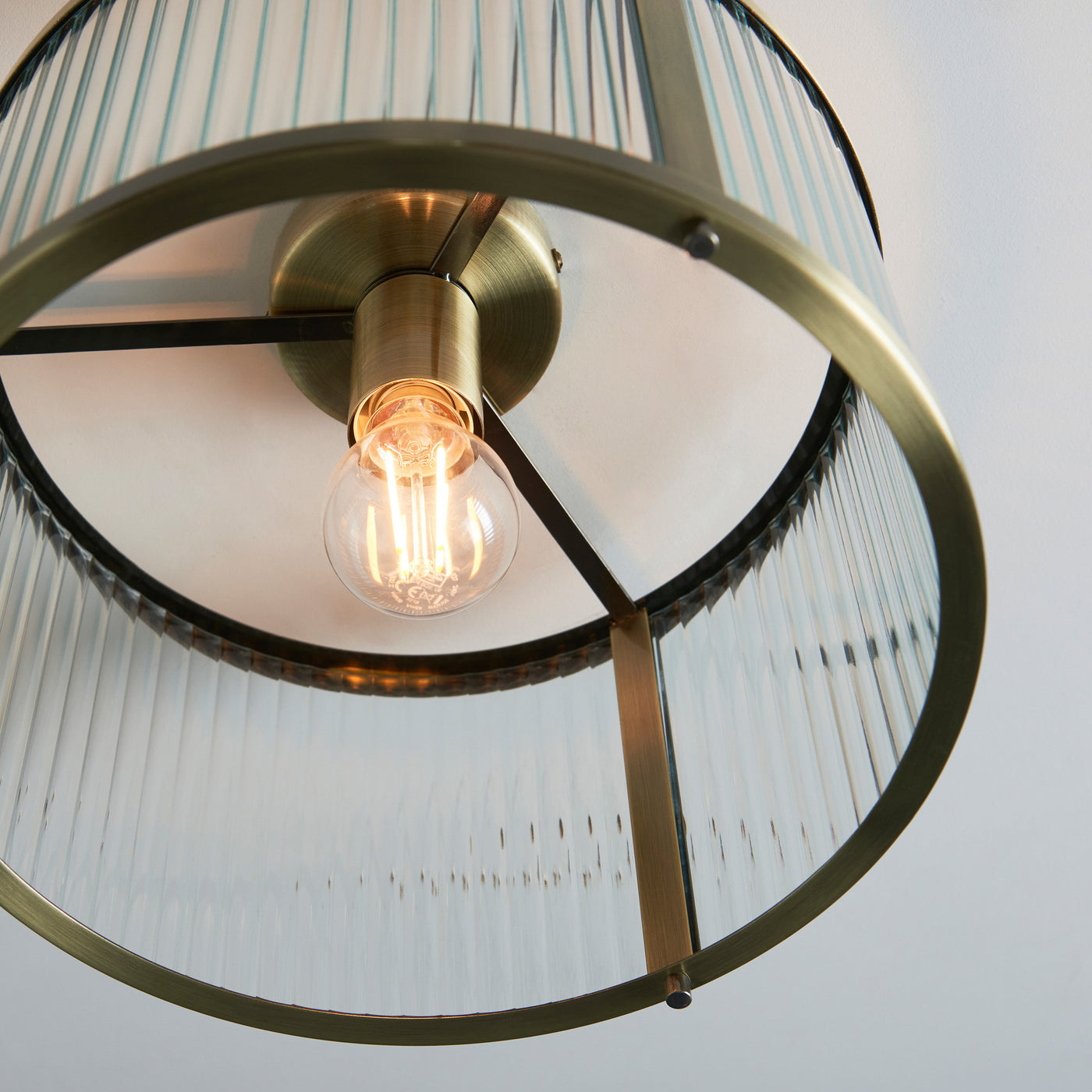 image taken from below of antique brass ribbed ceiling light 