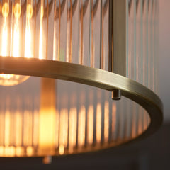 close up image of antique brass edges of ribbed pendant light
