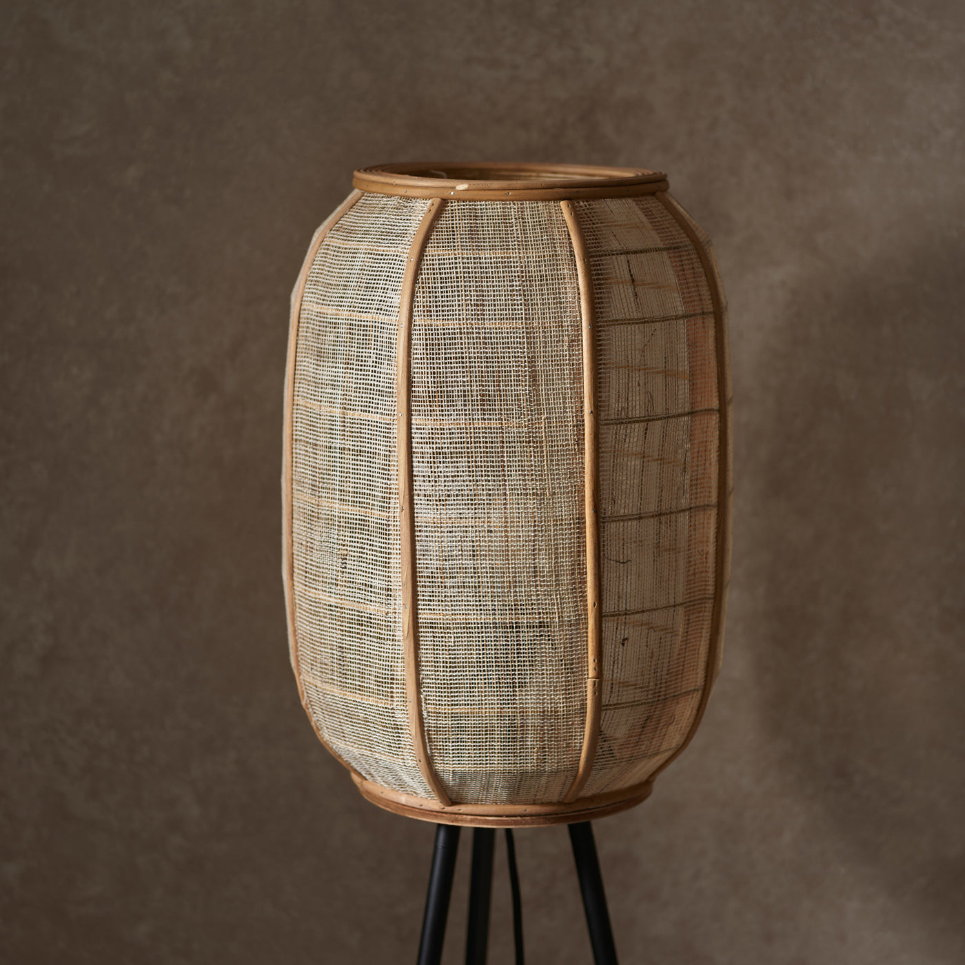 close up on linen and wooden shade of boho floor lamp