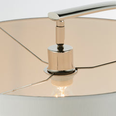 image taken from below of bulb held within natural linen shade