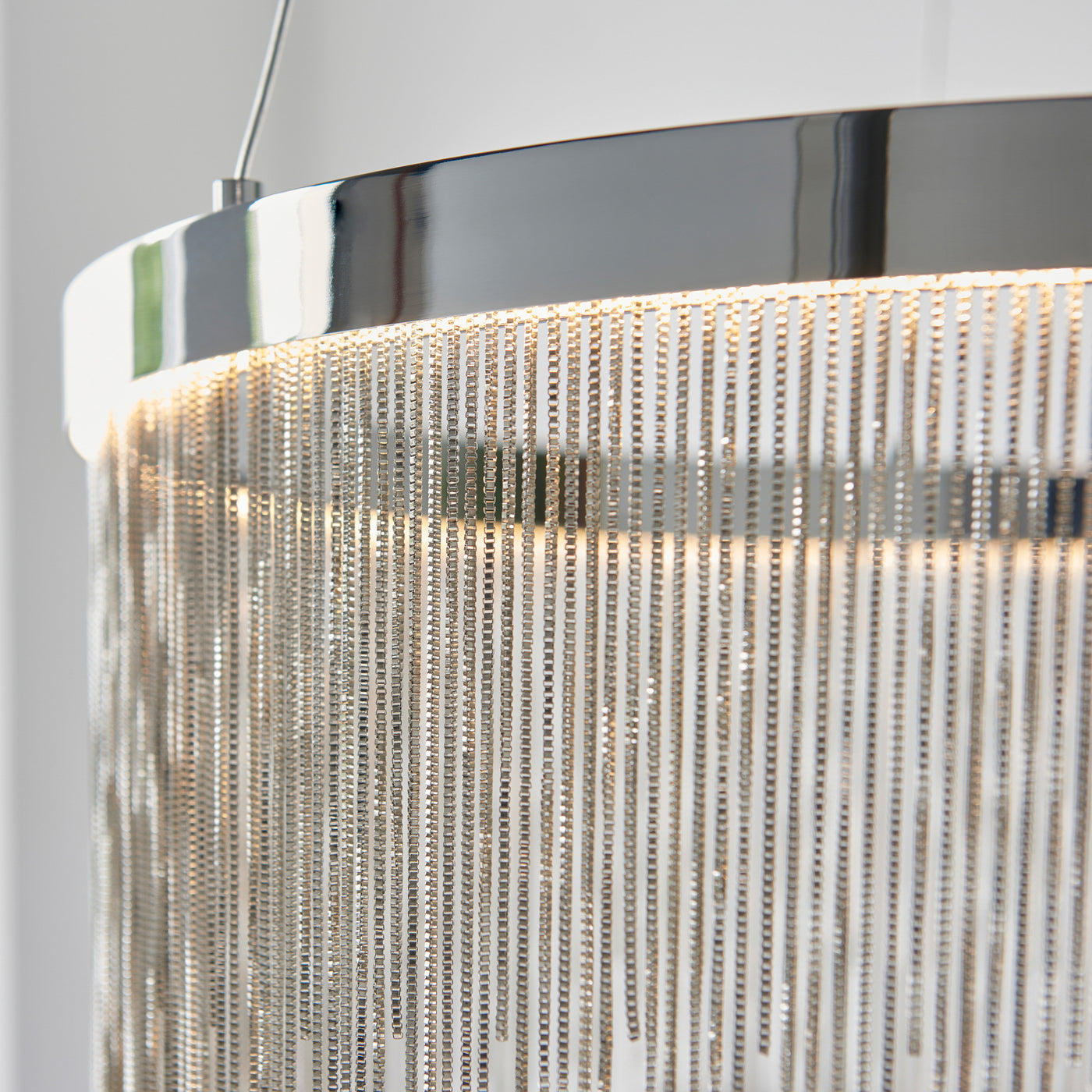 close up on chrome tasselled ceiling pendant light