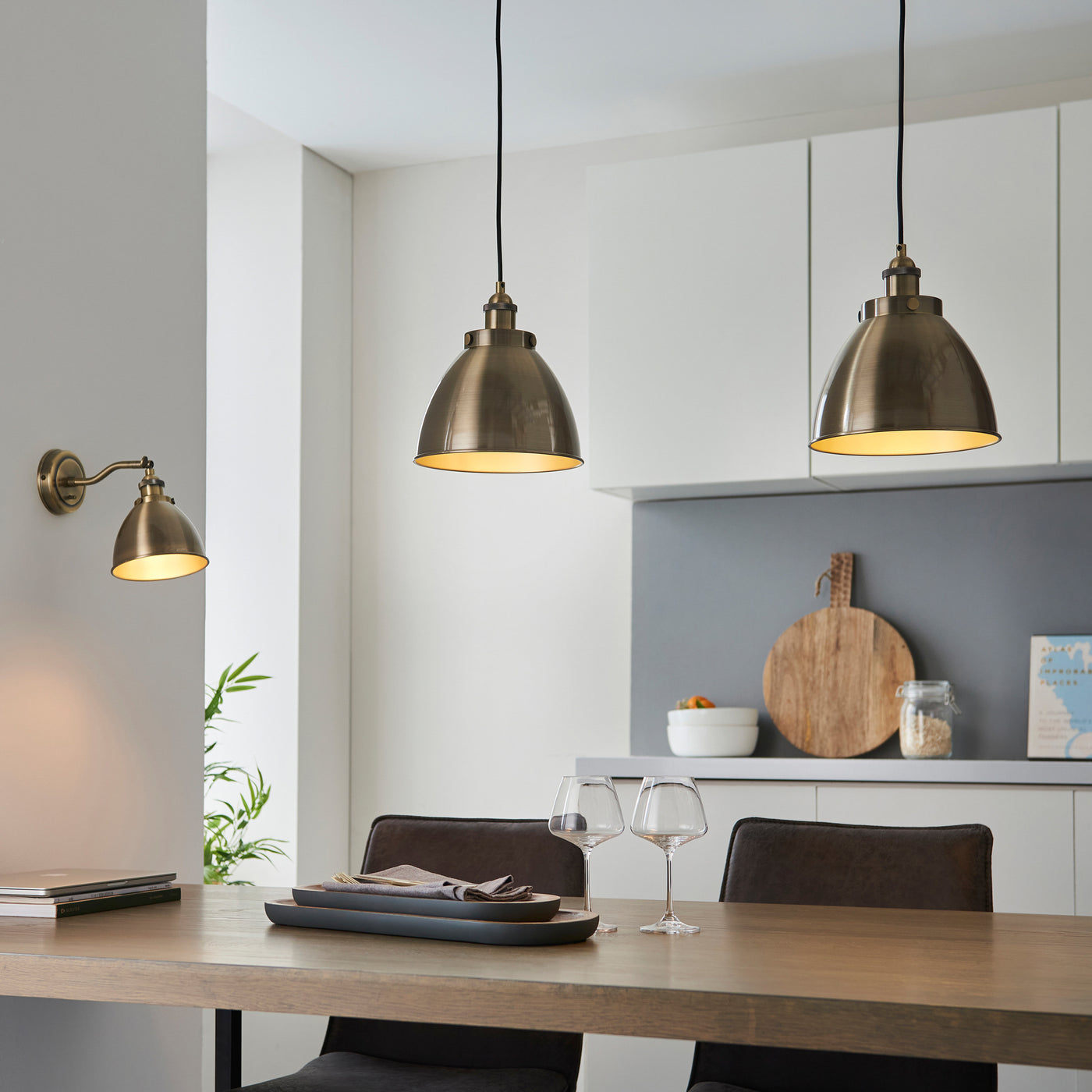 image of antique brass pendant lights hanging over a kitchen table