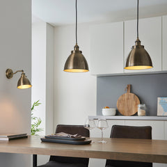 image of antique brass pendant lights hanging over a kitchen table