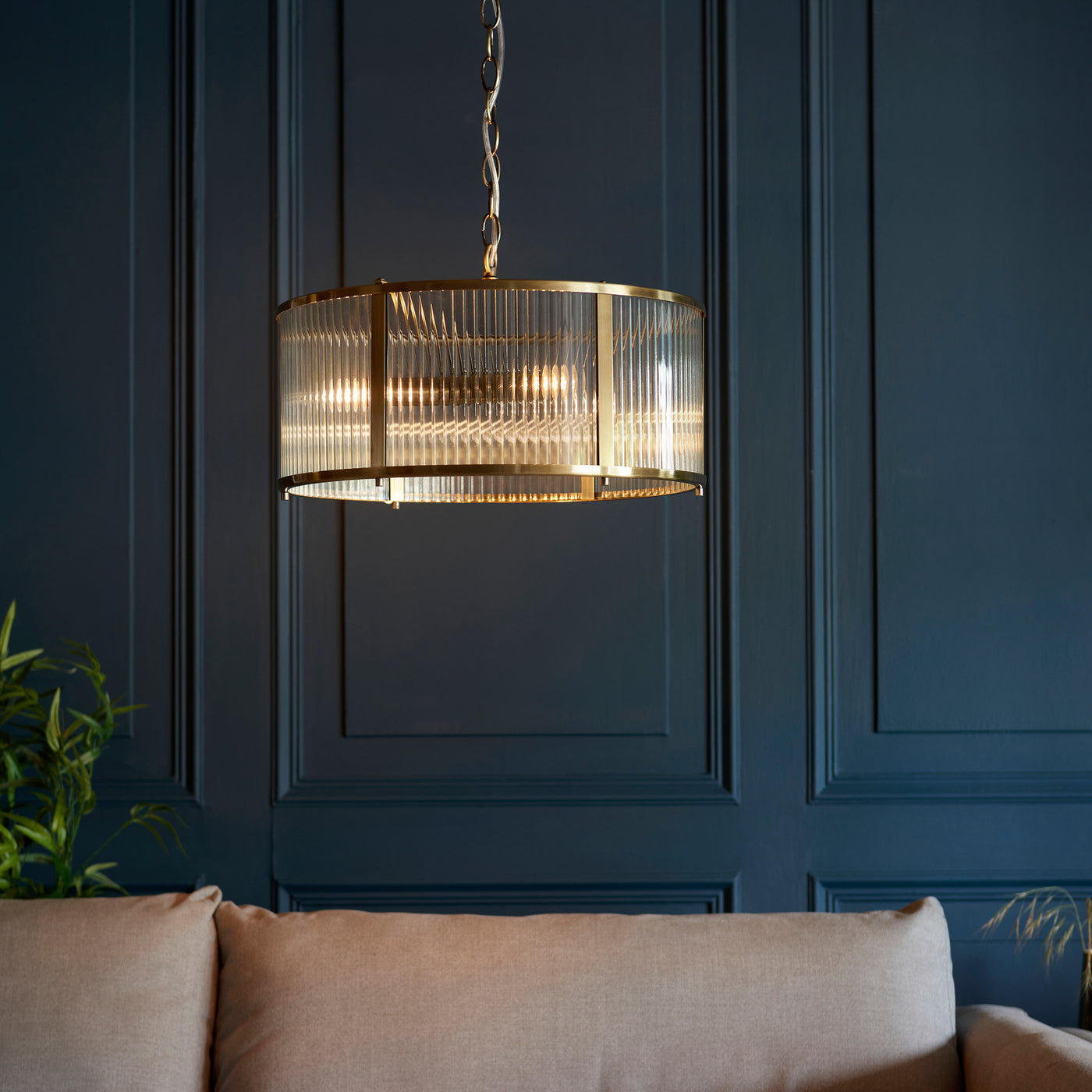 image of ribbed glass pendant light with antique brass metalwork