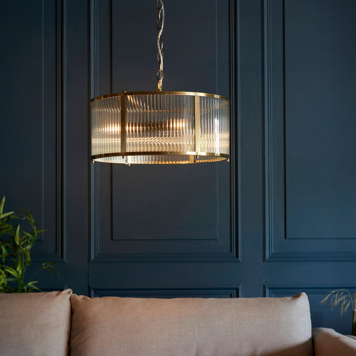 image of ribbed glass pendant light with antique brass metalwork