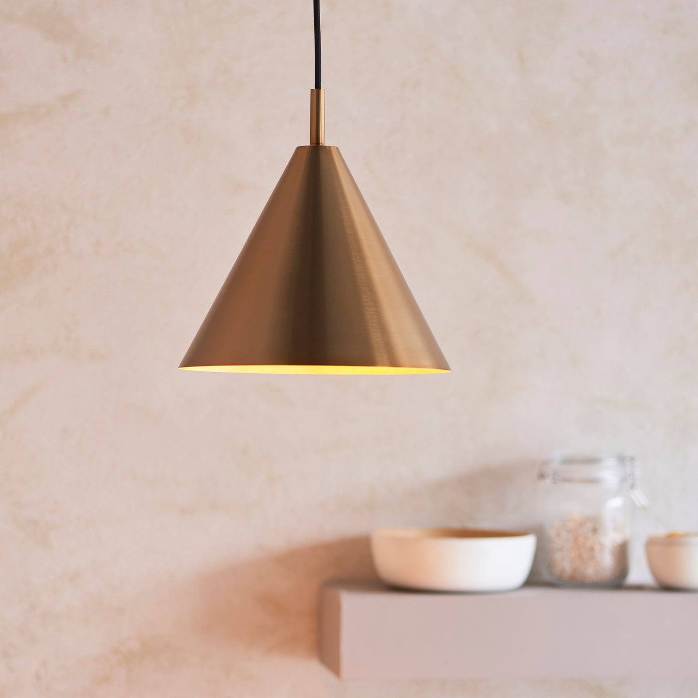 close up on antique brass conical ceiling light