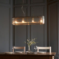 image of ribbed glass four pendant light hanging over dining table