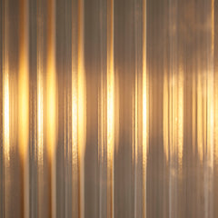 close up image of ribbed glass of pendant light with warm light emitting