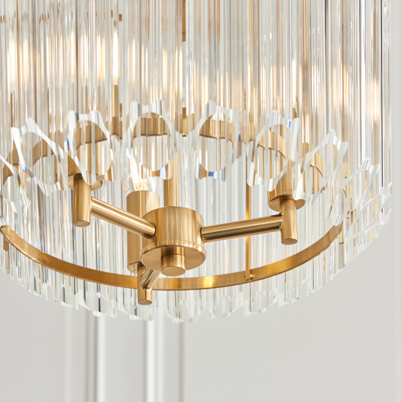 image taken from underneath glass pendant light to show brass fixture underneath