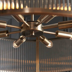 close up image taken from underneath looking up at 8 bulbs in ribbed glass pendant light