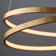 close up on circular abstract shape of scribble pendant light in gold