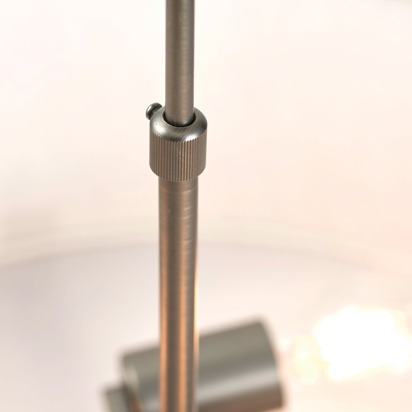 close up image of bronze-effect pendant of ceiling light