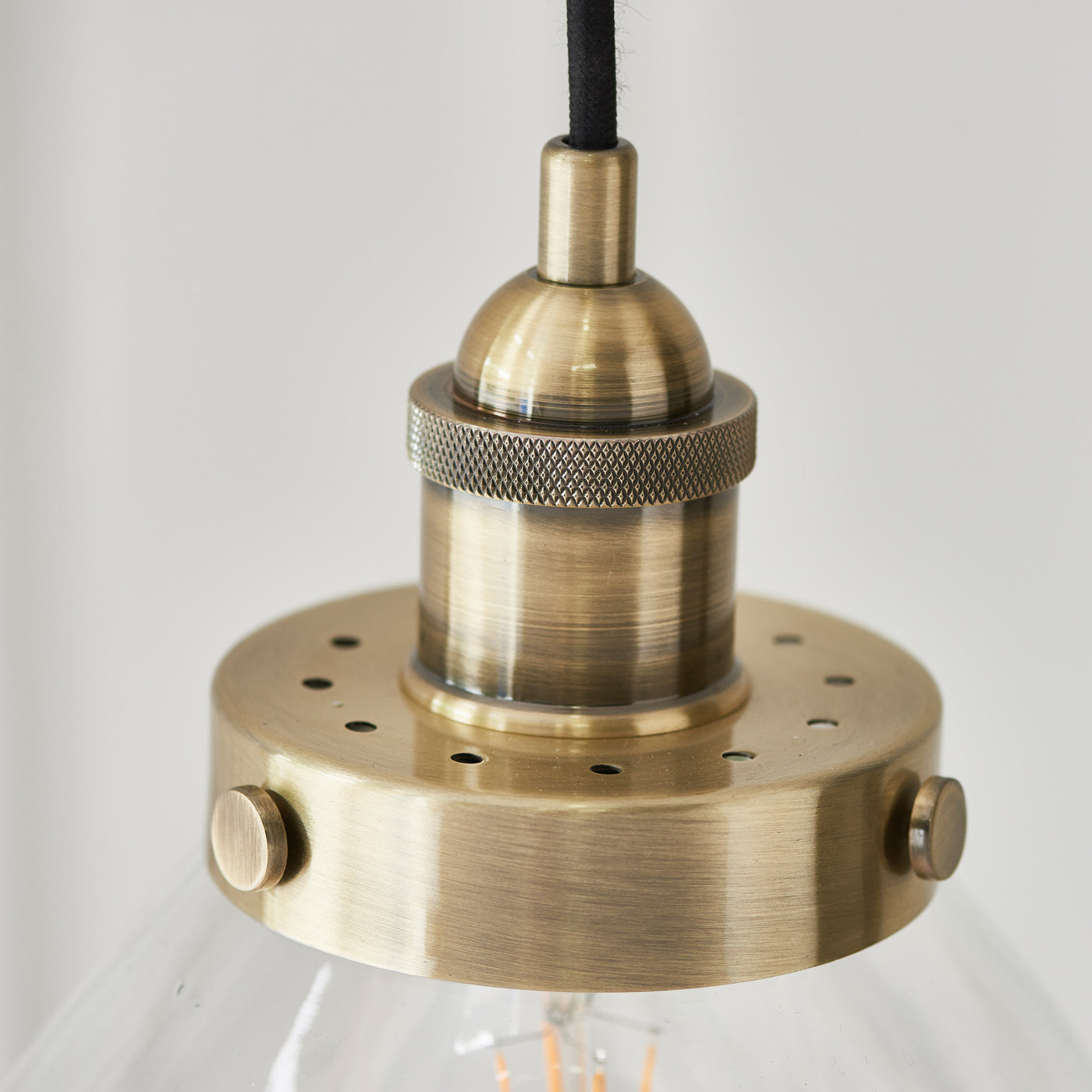 close up image of antique brass colour of pendant light fixture
