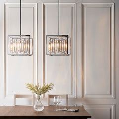 image of two smaller prism ceiling lights hanging above a wooden dining table