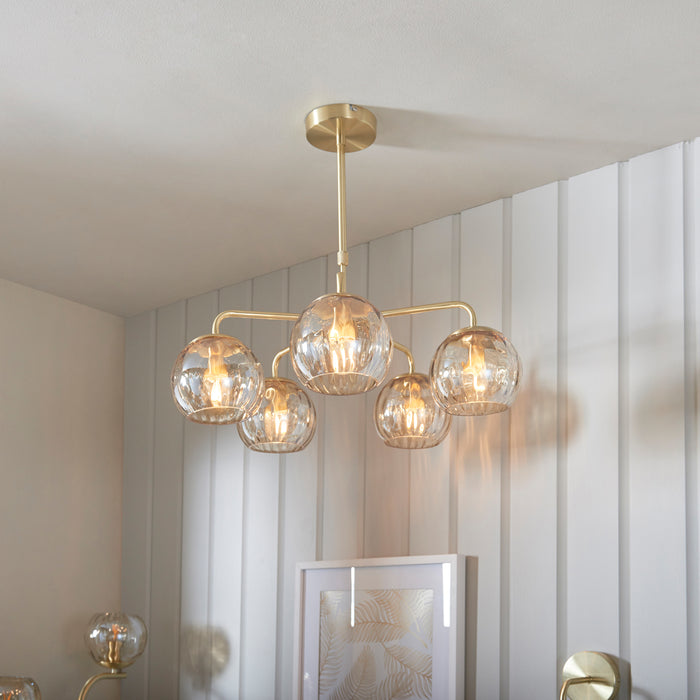 image of five pendant dimpled glass lights in champagne colour