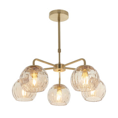 cut out image of dimpled glass champagne coloured ceiling light