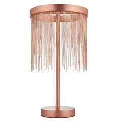 image cut out on white background of brushed copper tasselled table lamp