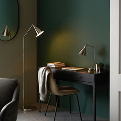 image of nickel floor lamp stood next to desk with its matching table lamp on top of it