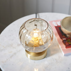 image taken from above looking down into champagne dimpled glass table light