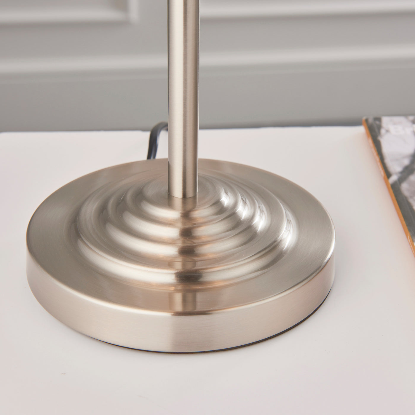 close up on bottom of lamp with chrome metalwork