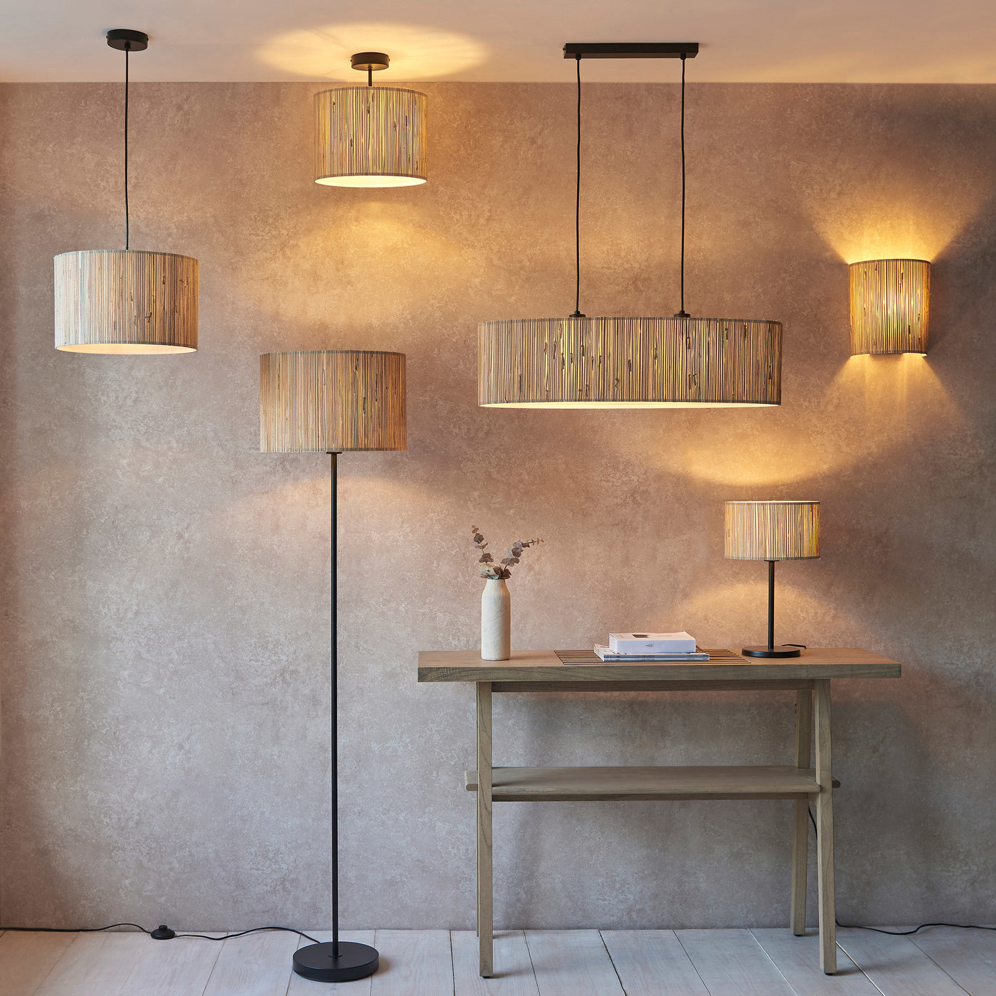wide image of seagrass lighting range including floor lamp, table lamp and ceiling light