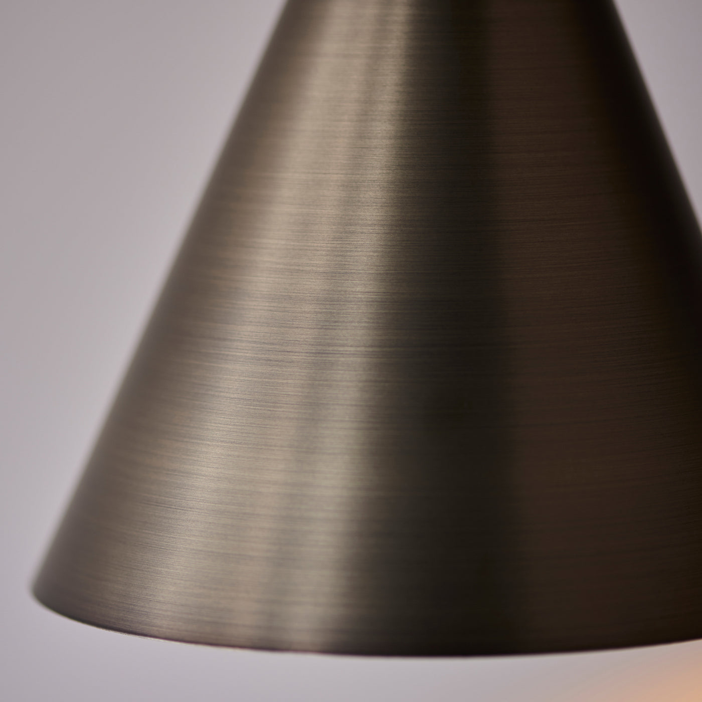 close up on texture and colour of antique bronze wall light