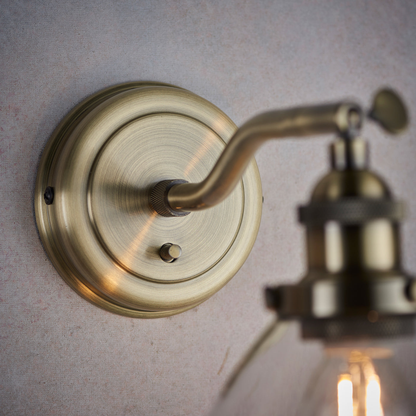 close up image of antique brass colour of wall light fixture